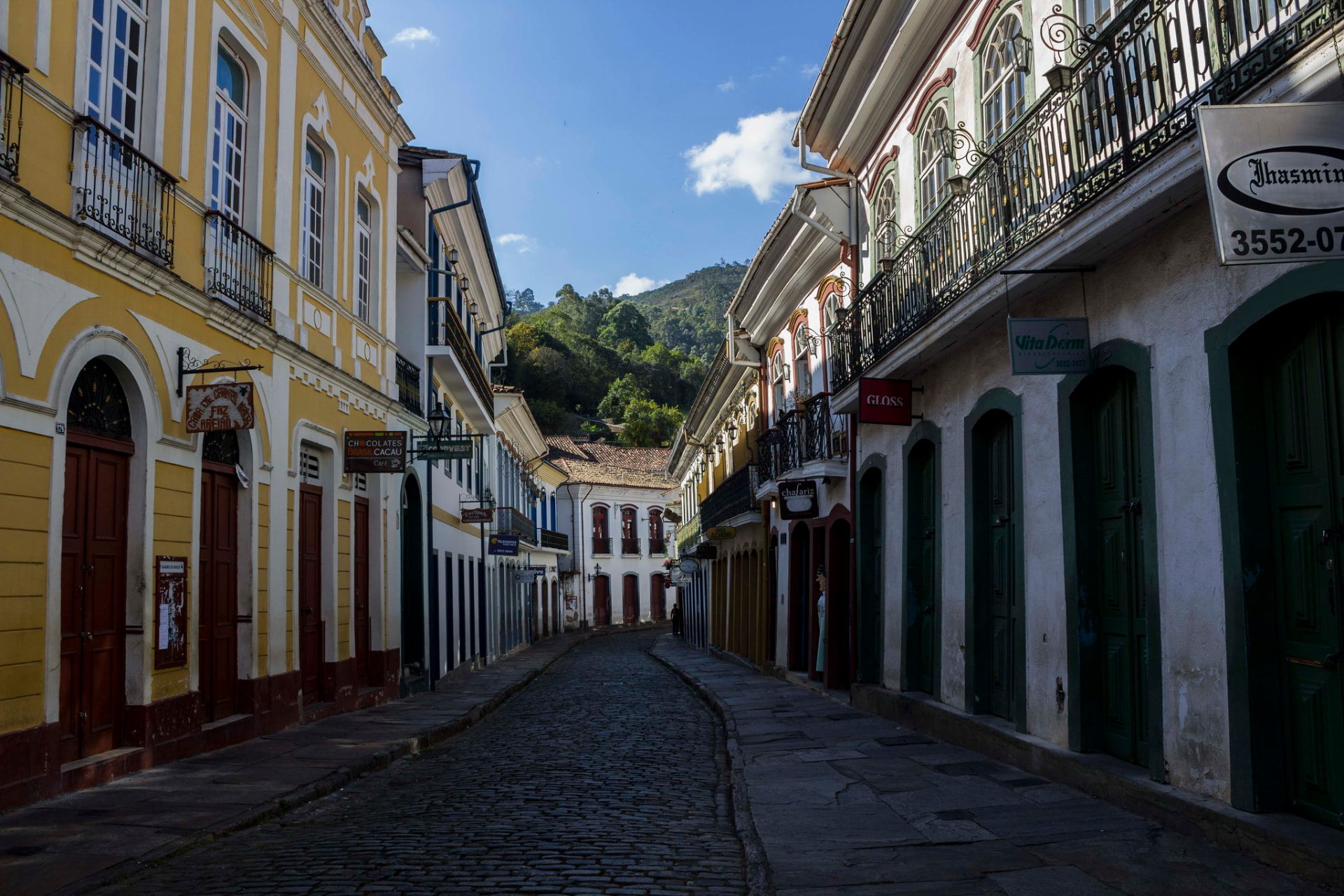 Colonial street in Ouro Preto, Minas Gerais, with mountains behind